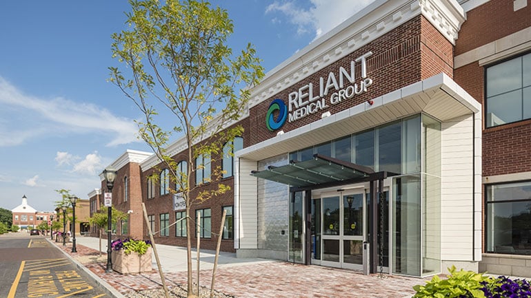 Exterior view of brick building with Reliant Medical Group logo on it