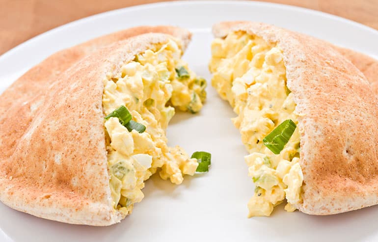 Scrambled eggs inside pita bread