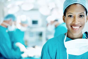 Woman wearing scrubs smiling